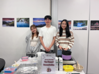 The booth for the Thai Coconut Pudding Demonstration was managed by Thai student hosts Patitta (Laws/Year 2) (left) and Jirapong (middle). 